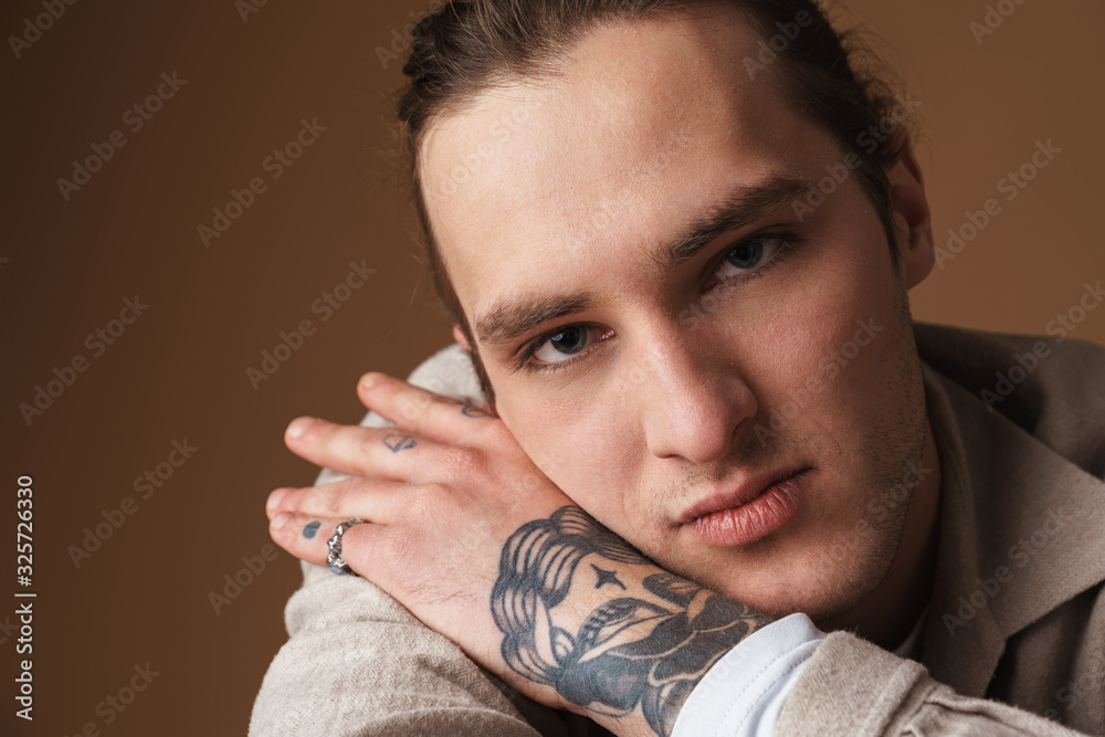 Close up of a smiling young man wearing casual clothes Close up of a smiling young man wearing casual clothes