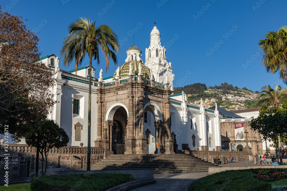 QUITO, ECUADOR - FEBRUARY 07, 2020: Plaza Grande and Metropolitan Cathedral, historic colonial downtown of Quito, Ecuador. South America.