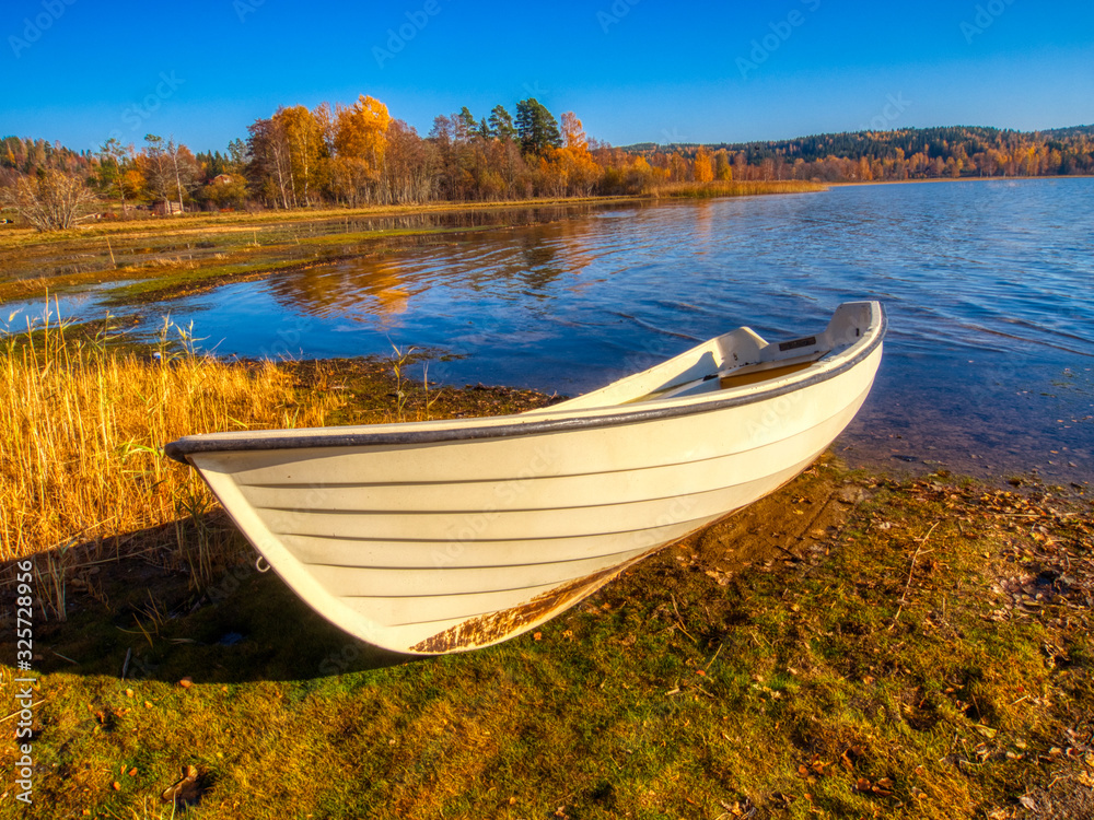 boat on the lake in autumn