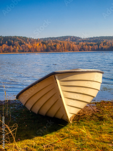 bow of rowboat by the lake