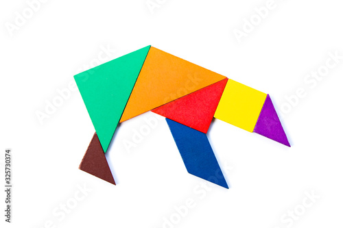 Color wood tangram puzzle in grizzly or polar bear shape on white background