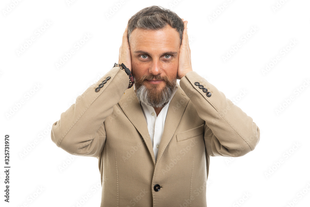 Portrait of man wearing smart casual covering ears Portrait of man wearing smart casual covering ears
