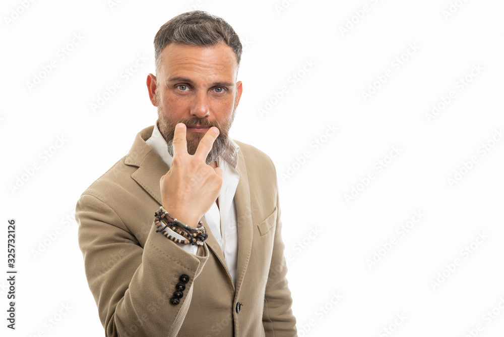 Man wearing smart casual clothes making look into eyes gesture Man wearing smart casual clothes making look into eyes gesture