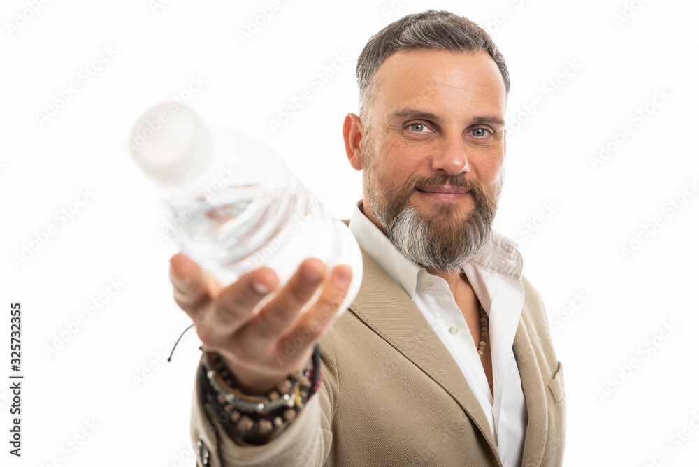Man wearing smart casual offering bottle of water Man wearing smart casual offering bottle of water