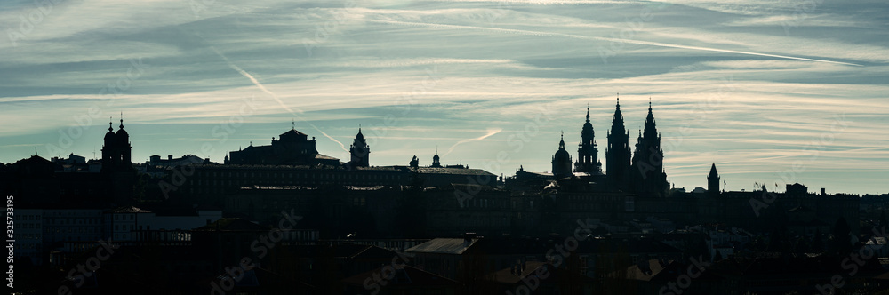 Wide Panoramic view of Santiago de Compostela. Silhouetted skyline of Compostela old town