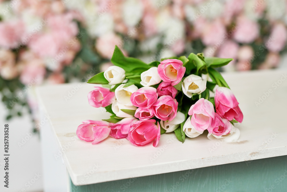 Fototapeta premium Tulips on floral background on flowers festive background, pastel and soft bouquet floral card. Spring Greeting Card Template. Copy Space. Wedding scene. Mothers Day,female card