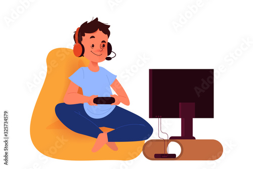 Happy boy on the couch with console controller