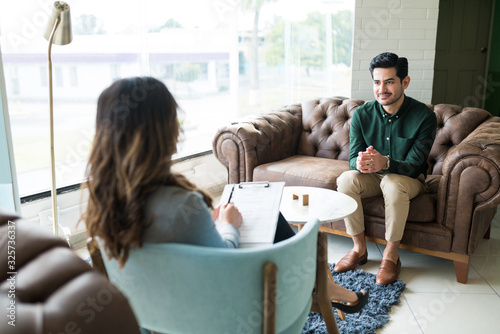 Male Professional Seeking Advice From Therapist At Office photo