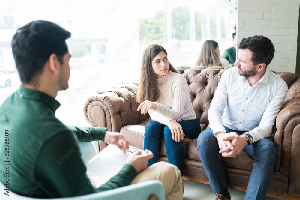 Couple Having Disagreement During Therapy Session Couple Having Disagreement During Therapy Session