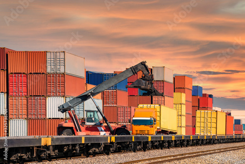 crane lifting container box to container truck a logistics transports in shipyard, a supply chain technology and logistics concept