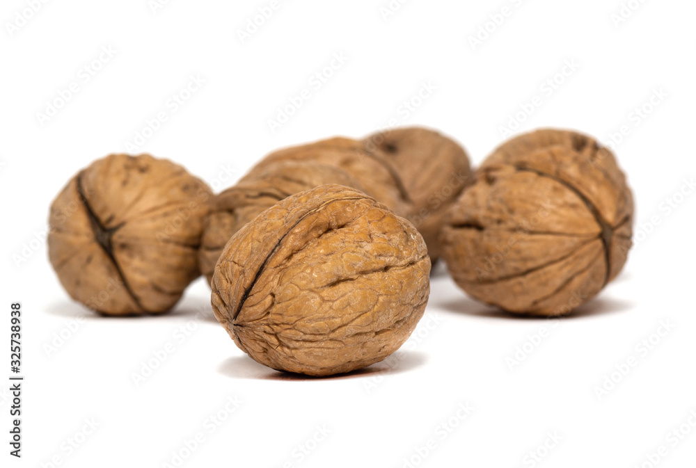 Delicious whole walnuts isolated on a white background Delicious whole walnuts isolated on a white background