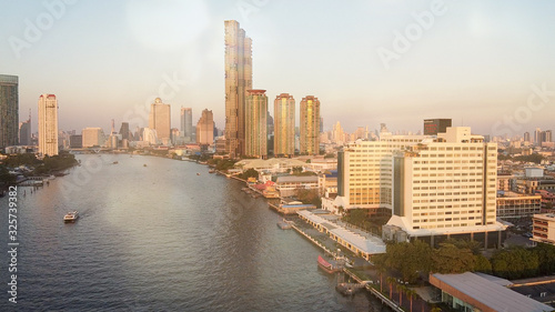 Bangkok, Thailand. Aerial view of cityscape and Chao Phraya River ar sunset © jovannig