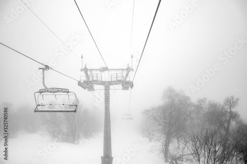 Ski lift through snow blizzard in Bakuriani, Georgia