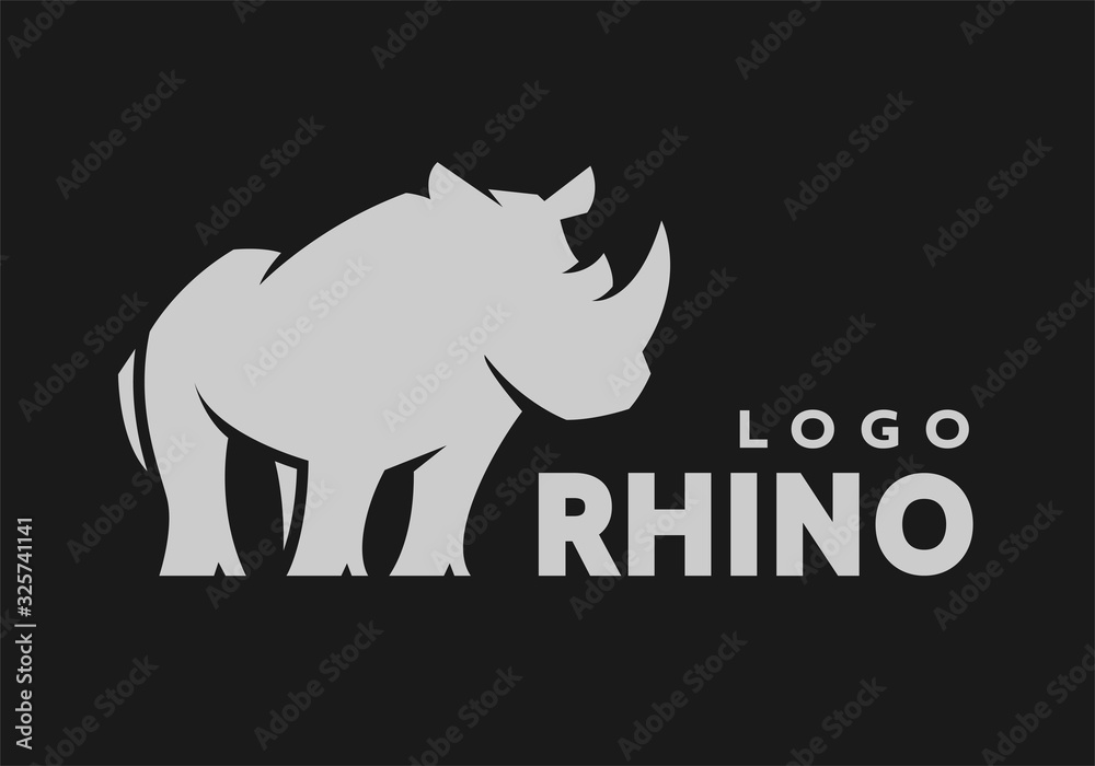 Obraz premium African rhino silhouette. Logo, symbol on a dark background. Vector illustration.