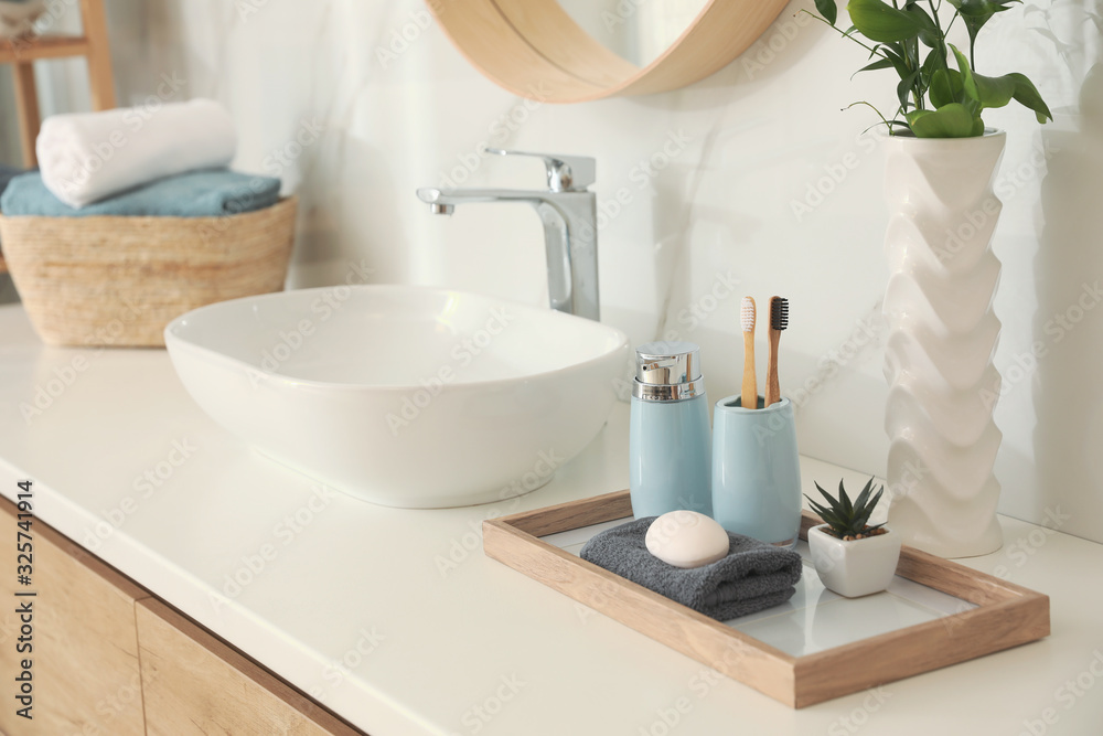 Countertop with sink and toiletries in bathroom. Interior design Countertop with sink and toiletries in bathroom. Interior design