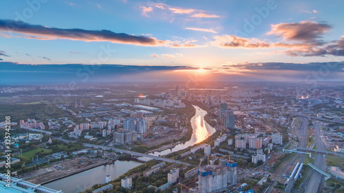 Aerial top view of Moscow city timelapse at sunset. Form from the observation platform of the business center of Moscow City. photo