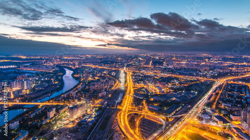Aerial top view of Moscow city day to night timelapse after sunset. Form from the observation platform of the business center of Moscow City.