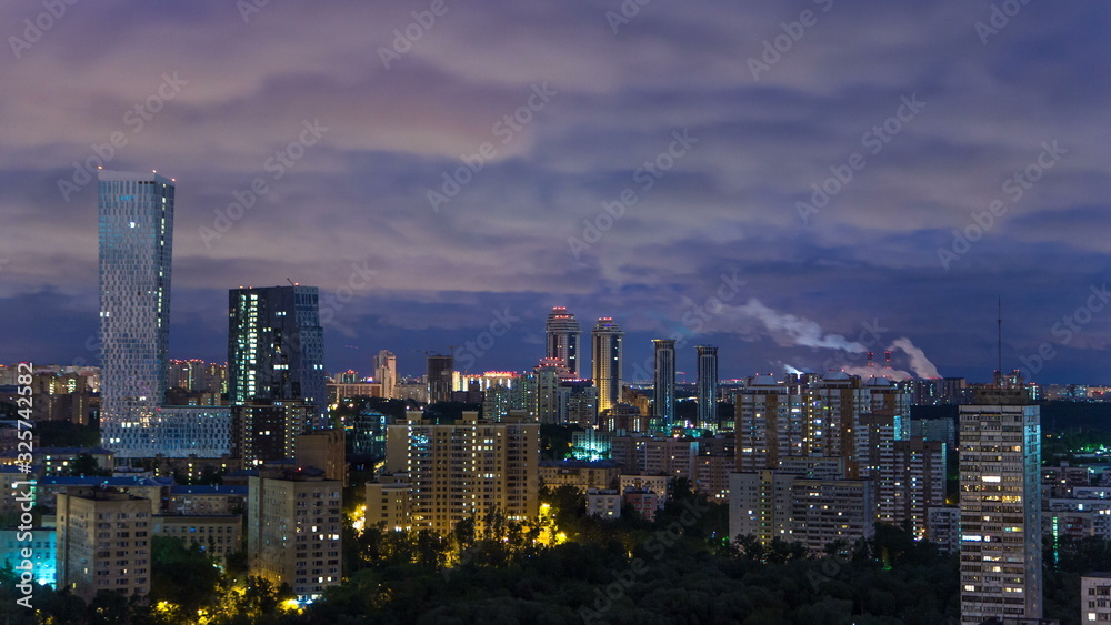 Panoramic view of Moscow timelapse. Panorama of a big city at night. Residential buildings on Mosfilmovskaya street