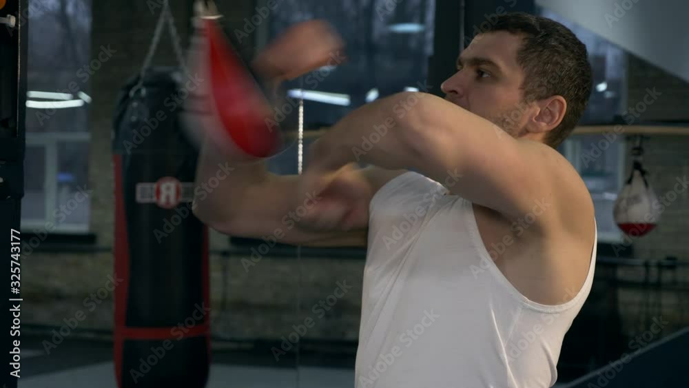 Close-up. Boxer Fighter Hits With Fists Speed Bags. Caucasian Man Training in Gym. 2x Slow motion - 1/2 60 FPS Close-up. Boxer Fighter Hits With Fists Speed Bags. Caucasian Man Training in Gym. 2x Slow motion - 1/2 60 FPS