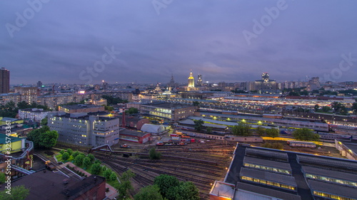 Evening top view of three railway stations day to night timelapse at the Komsomolskaya square in Moscow, Russia photo