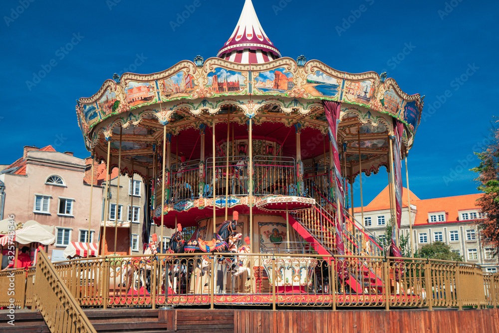 Bright red and golden carousel with horses and bright glowing lights turning around without passengers in darkness of night. Real time full hd video footage. Bright red and golden carousel with horses and bright glowing lights turning around without passengers in darkness of night. Real time full hd video footage.