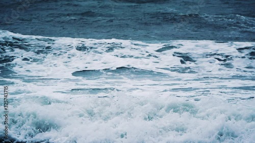 Windy weather big stormy sea waves. Slow Motion. Ocean Waves During a Storm. Powerful Sea Tropical Hurricane. Global Warming. Slow Motion.