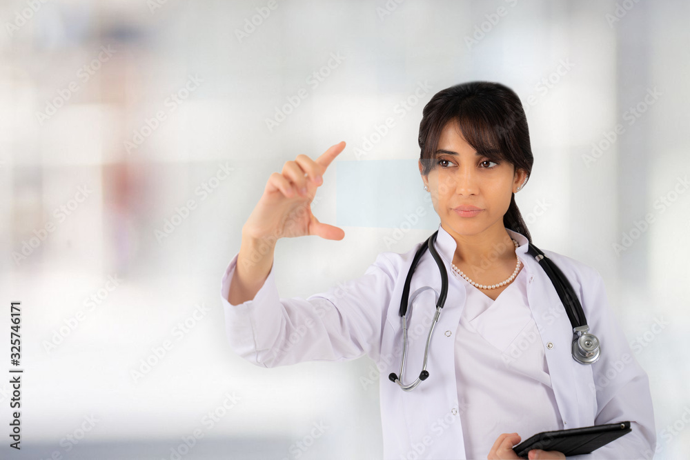 A young girl doctor or student stands in the hospital lobby A young girl doctor or student stands in the hospital lobby