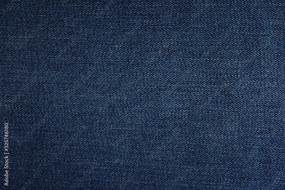 Texture of dark blue jeans as background, closeup Texture of dark blue jeans as background, closeup