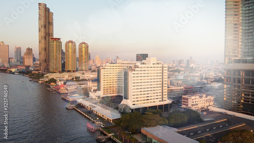 Bangkok, Thailand. Sunset aerial view of Asiatique Riverfront with cityscape and Chao Phraya River © jovannig