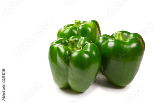 Group of green bell peppers isolated on white background. Top view.