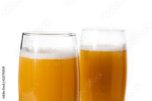 Bellini champagne cocktail in glass isolated on white background. Close up