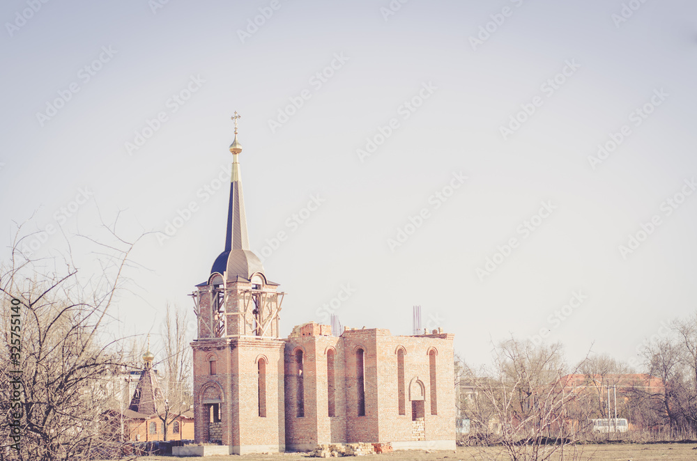 Obraz premium construction of a new red brick church