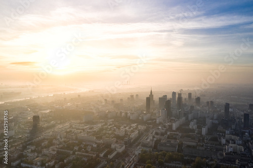 Aerial view of skyscrapers in the center of the Warsaw at sunrise.