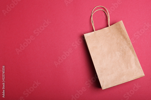 packages for shopping on a colored background top view. Minimalism, place for text.