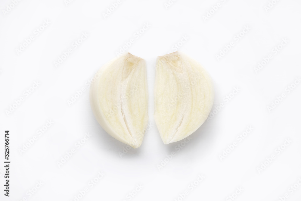 young garlic cut in two isolated on white background. closeup of fresh white garlic. organic natural food, vegetables concept young garlic cut in two isolated on white background. closeup of fresh white garlic. organic natural food, vegetables concept