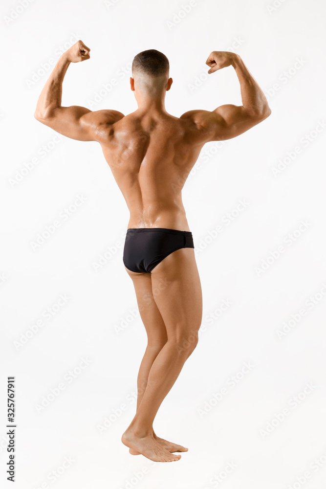 Back of a strong man on white background Back of a strong man on white background