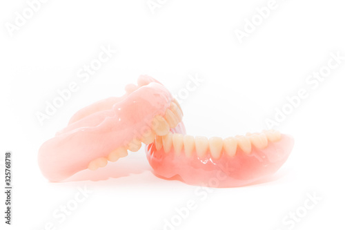 complte denture on white background