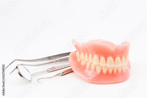 teeth and dental mirror, symbol photo of dentures, diagnosis and copayment