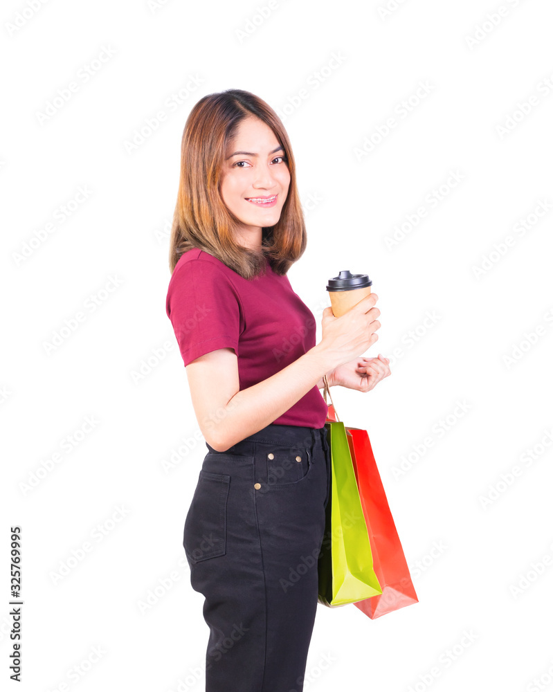 woman pretty smiling holding paper bags and Coffee carton cup in shopping. on white background and look at camera woman pretty smiling holding paper bags and Coffee carton cup in shopping. on white background and look at camera