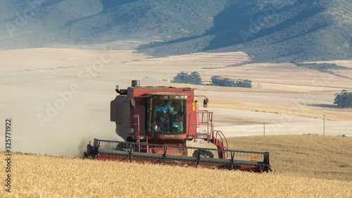 Combine Harvester near the mountain of Riebeek. photo