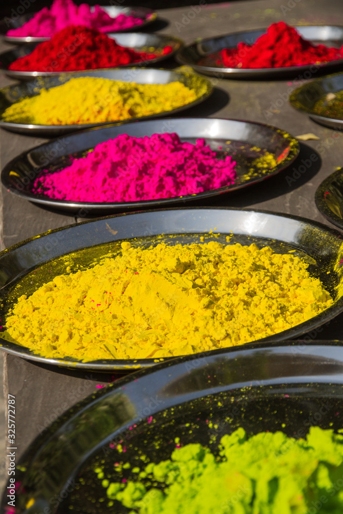 Plates with colourful powders set for Holi. This festival marks the beginning of spring and is celebrated by trowing vibrant pigments on each other. Plates with colourful powders set for Holi. This festival marks the beginning of spring and is celebrated by trowing vibrant pigments on each other.
