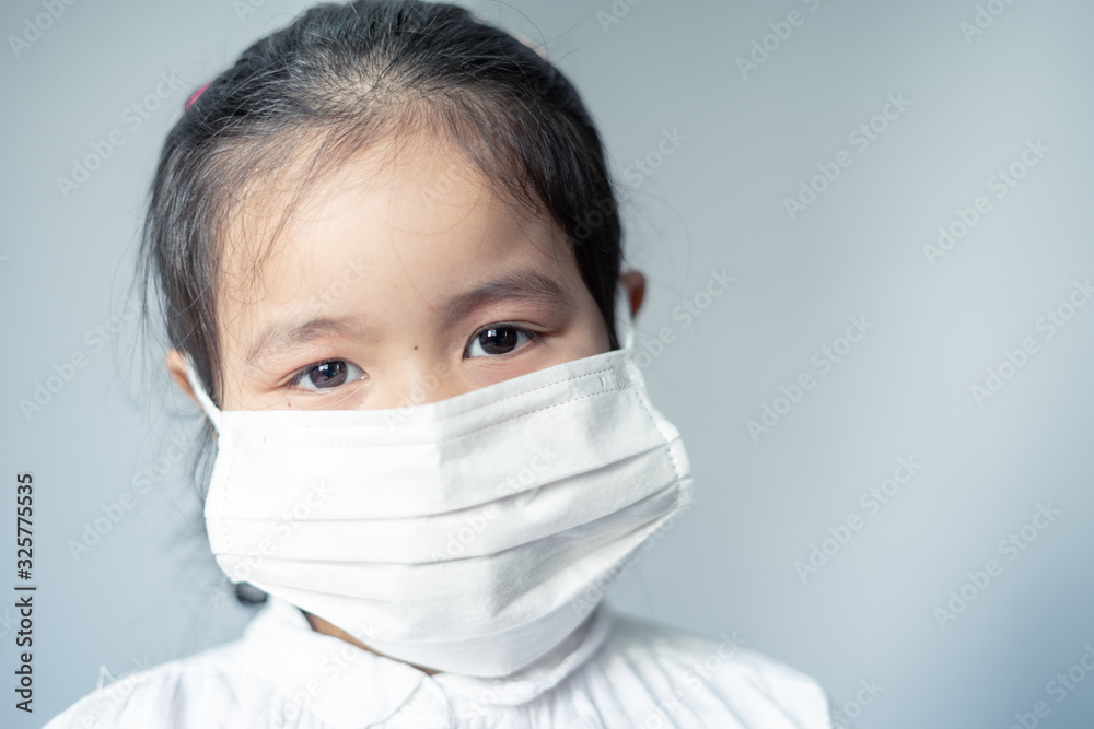 Girl waring mask to protect Covid-19 virus and PM2.5 air pollution Girl waring mask to protect Covid-19 virus and PM2.5 air pollution