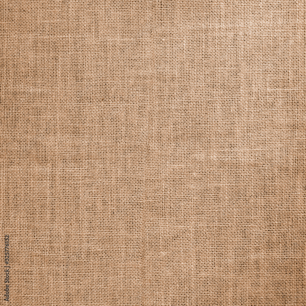 The rough texture of the cloth, jute canvas, beige,brown,grunge, rustic The rough texture of the cloth, jute canvas, beige,brown,grunge, rustic