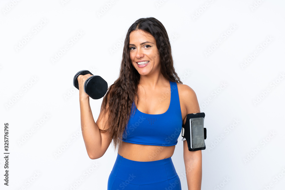 Young sport woman over isolated white background making weightlifting Young sport woman over isolated white background making weightlifting