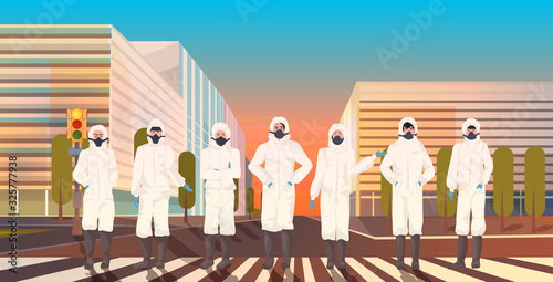 asian people wearing hazmat suits and protective masks to prevent coronavirus epidemic MERS-CoV virus empty city street wuhan 2019-nCoV pandemic health risk cityscape background full length horizontal