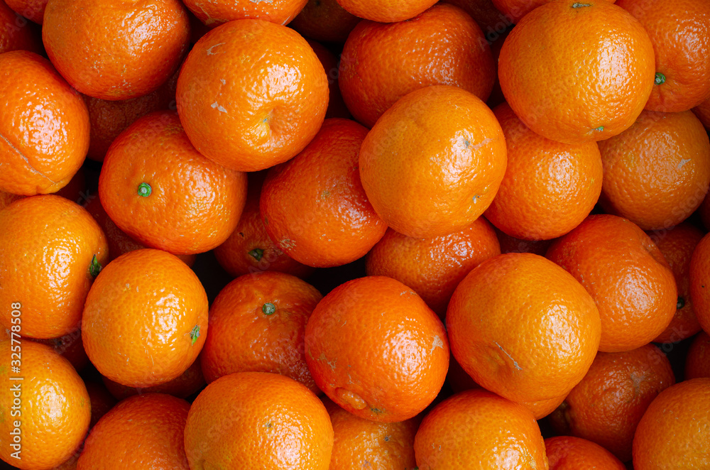 Juicy organic mandarins background. Top view. Tangerines. Juicy organic mandarins background. Top view. Tangerines.