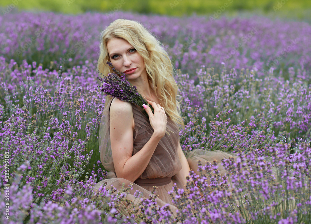 blonde girl in lavender field in summer enjoying vacation blonde girl in lavender field in summer enjoying vacation