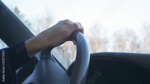 Wallpaper Mural female hands held behind the wheel of a car.close-up. shallow depth of field Torontodigital.ca