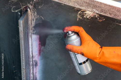 The step fourth of doing penetrant testing is step to use Developer spray into the welded to pull the liquid penetrate from the defect for Non-Destructive Testing with process Penetrant Testing(PT)