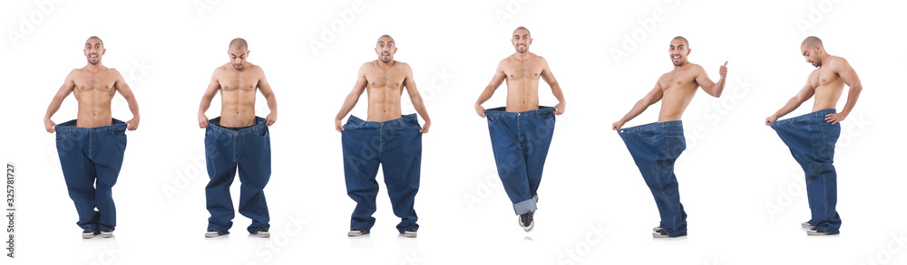Man in dieting concept with oversized jeans Man in dieting concept with oversized jeans